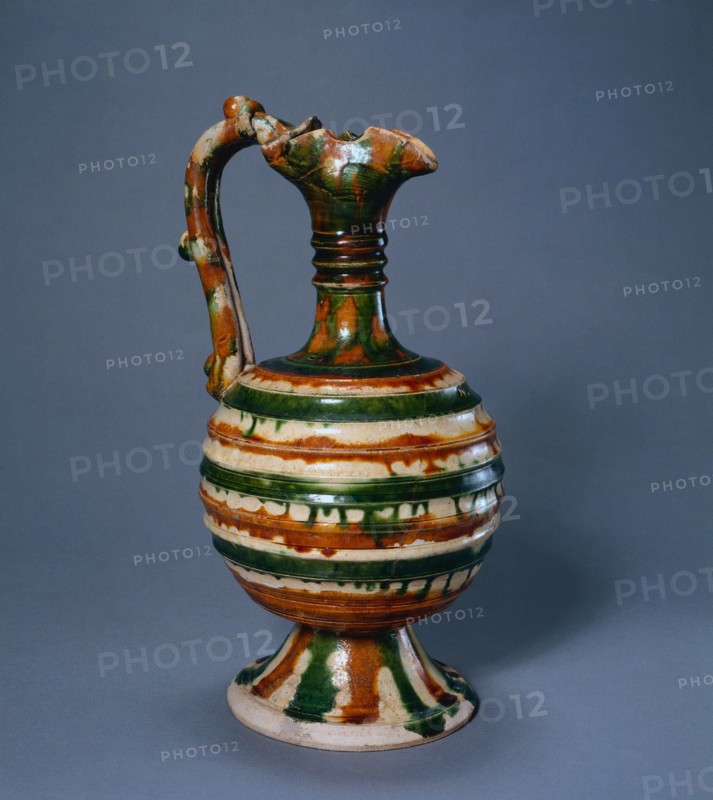 Ewer, 700-750. China, Tang dynasty (618-907). Glazed earthenware, sancai (three-color ware); diameter: 13.5 cm (5 5/16 in.); overall: 27.3 cm (10 3/4 in.).
