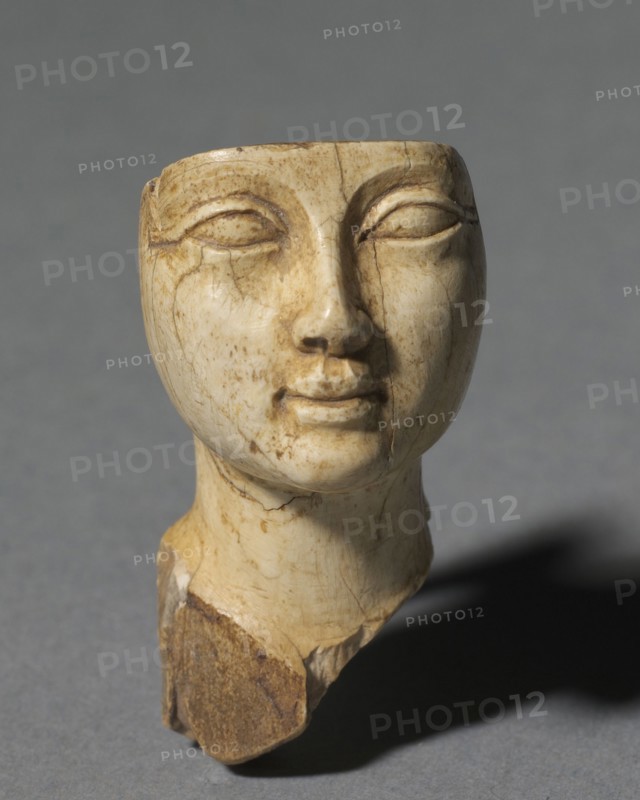 Face from a Cosmetic Spoon, 1391-1353 BC. Egypt, New Kingdom, Dyansty 18 (1540-1296 BC), reign of Amenhotep III. Ivory; overall: 4 x 2.3 cm (1 9/16 x 7/8 in.).