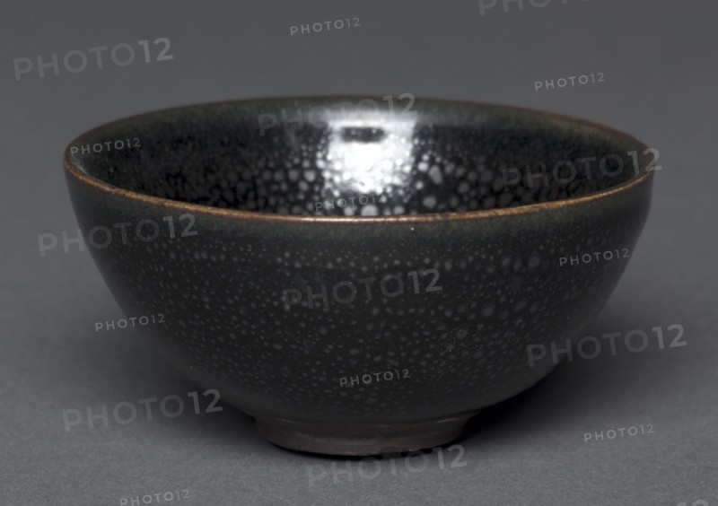 Tea Bowl, 1100-1200s. Northern China, Henan province, Northern Song dynasty (960-1127) or Jin dynasty (1115-1234). Stoneware with "oil spot" glaze, black ware; diameter: 8.8 cm (3 7/16 in.); overall: 4.4 cm (1 3/4 in.).
