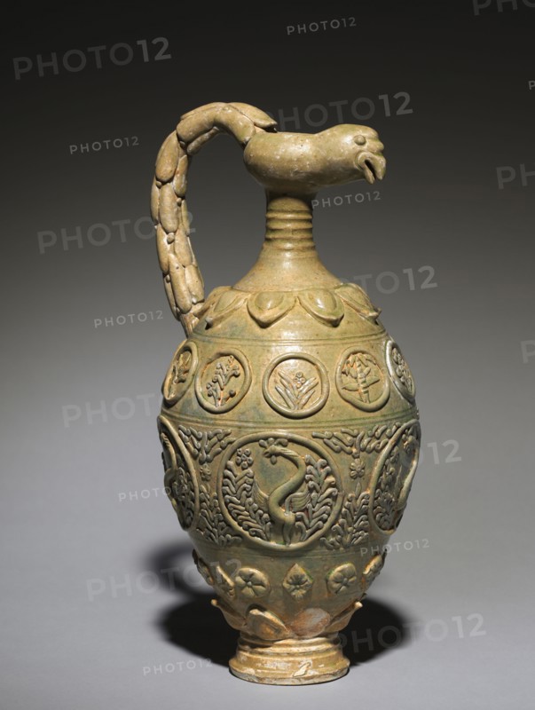 Bird-Headed Ewer, 600s-700s. China, probably Henan province, Tang dynasty (618-907). Green-glazed stoneware with modeled, molded, and applied decoration; overall: 42.1 cm (16 9/16 in.).