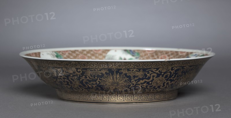 Dish with Zhang Guolao, 1662-1722. China, Jiangxi province, Jingdezhen kilns, Qing dynasty (1644-1912), Kangxi reign (1661-1722). Porcelain with famille verte overglaze enamel and painted gold decoration (interior) and powder blue glaze with painted decoration (exterior); diameter: 4.6 x 19.8 cm (1 13/16 x 7 13/16 in.).