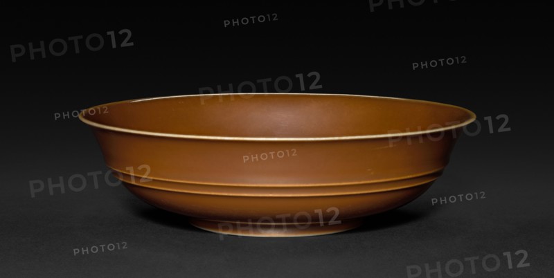 Dish, 1723-1735. China, Jiangxi province, Jingdezhen kilns, Qing dynasty (1644-1912), Yongzheng mark and reign (1722-1735). Porcelain with café-au-lait glaze; diameter: 17 cm (6 11/16 in.); overall: 3.5 cm (1 3/8 in.).