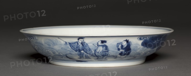 Dish with Laozi Riding a Water Buffalo (interior); Pavilion and Immortals in Rocky Landscape (exterior), 1723-1735. China, Jiangxi province, Jingdezhen kilns, Qing dynasty (1644-1912), Yongzheng reign (1722-1735). Porcelain with underglaze blue decoration; diameter: 19.9 cm (7 13/16 in.); overall: 7.2 cm (2 13/16 in.).