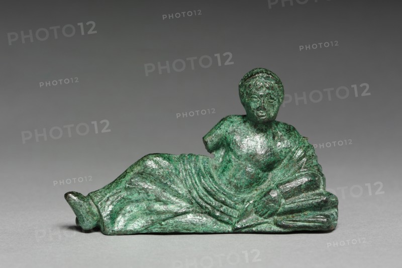 Vessel Ornament of Banqueter, c. 400-375 BC. Italy, Etruscan, early 4th Century. Bronze; overall: 5.1 x 1.8 cm (2 x 11/16 in.).