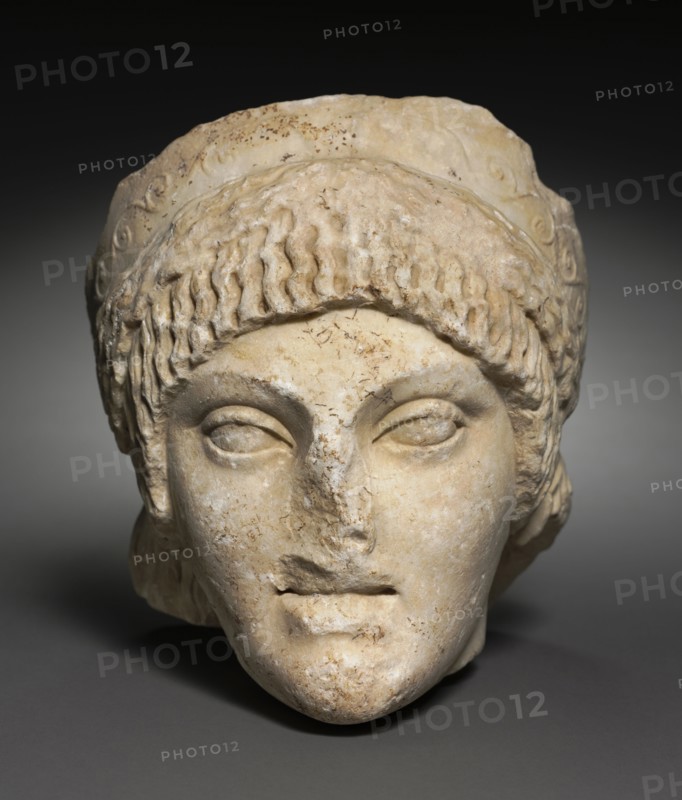 Head of a Young Woman, 25-1 BC. Italy, Roman, Roman Period, Archaizing, late 1st Century BC. Marble; overall: 23 x 19.5 x 18.5 cm (9 1/16 x 7 11/16 x 7 5/16 in.).
