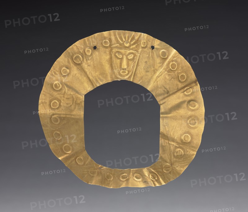 Disk, 300-600 (?). Peru, Nasca(?). Hammered and cut gold with repoussé design; diameter: 12.4 cm (4 7/8 in.).