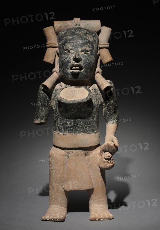 Standing Male Figure, 300-900. Mexico, Gulf Coast, 4th-10th Century. Earthenware, asphalt and resin paint; overall: 58.5 x 24.8 x 14.7 cm (23 1/16 x 9 3/4 x 5 13/16 in.).