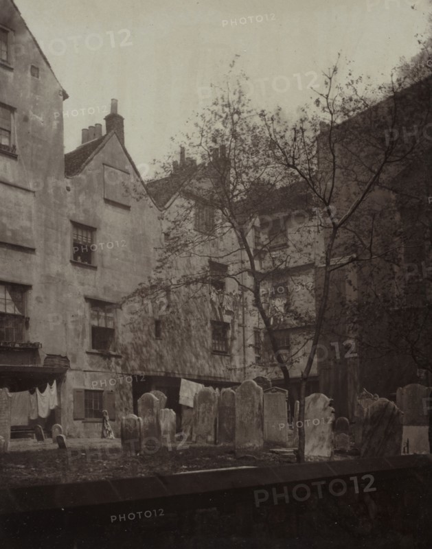 Old London: St. Bartholomews: The Churchyard Looking towards Cloth Fair, 1877. Alfred H. Bool (British), and John Bool (British), album issued by The Society for Photographing the Relics of Old London. Carbon print; image: 23.8 x 18.6 cm (9 3/8 x 7 5/16 in.); matted: 50.8 x 40.6 cm (20 x 16 in.)