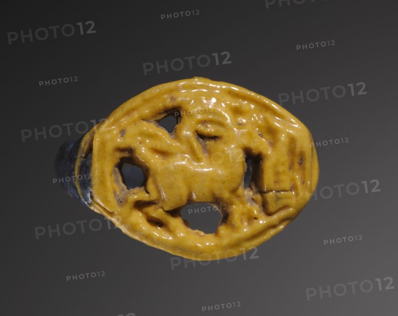 Ring: Gazelle Eating Thicket, 1391-1353 BC. Egypt, New Kingdom, Dynasty 18, reign of Amenhotep III to Akhenaten. Polychrome faience (yellow and purple); diameter: 2.5 cm (1 in.).