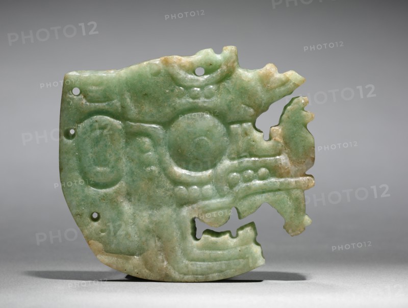 Ornament, Maya style (250-900). Mexico or Central America, Maya style (250-900). Jadeite-albitite; overall: 6.7 x 0.7 x 7.5 cm (2 5/8 x 1/4 x 2 15/16 in.).