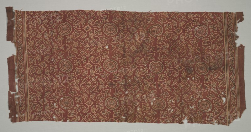 Fragment with geese circling lotus medallions, 1400s. India. Plain weave: cotton, stamped mordant resist and dyed; overall: 90.2 x 46.5 cm (35 1/2 x 18 5/16 in.).