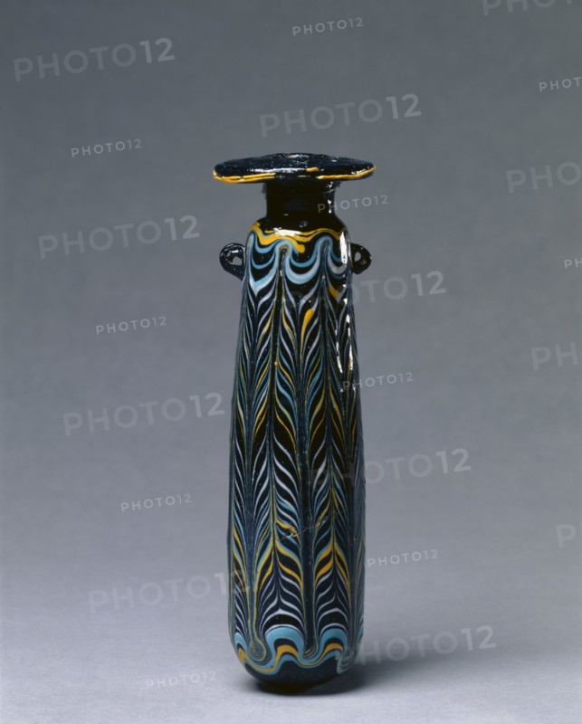 Perfume Bottle (Alabastron), c. 325-275 BC. Italy or Eastern Mediterranean, Etruscan, 4th-3rd Century BC. Glass; diameter: 5.1 cm (2 in.); overall: 16.5 cm (6 1/2 in.).