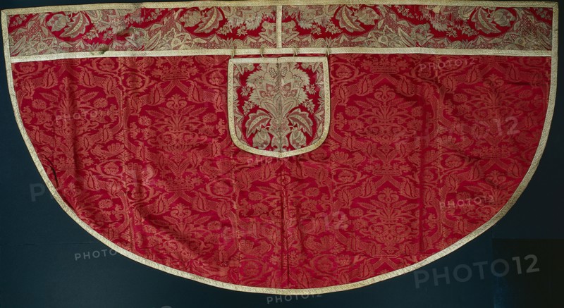 Priest's Red Cope, Orphrey and Hood, late 1500s - early 1600s. France and Italy, Orphrey and hood: France, Lyon, Regency period, 1715-1725; Cope: Italy,  late 16th - early 17th century. Cope: damask weave, silk; Orphrey and hood: brocade, silk and silver; overall: 145.4 x 275.4 cm (57 1/4 x 108 7/16 in.)