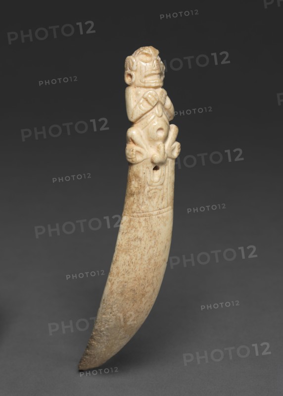 Spatula, 900-1492. Caribbean, Greater Antilles, Taino, 10th-15th century. Manatee bone; diameter: 1.7 cm (11/16 in.); overall: 19.1 x 3.2 x 11 cm (7 1/2 x 1 1/4 x 4 5/16 in.).