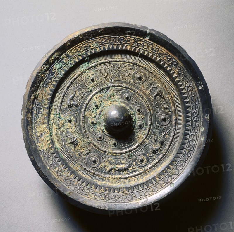 Mirror with Concentric Circles, an Immortal, and Auspicious Animals, 1st century. China, Eastern Han dynasty (25-220). Bronze; diameter: 16.3 cm (6 7/16 in.); overall: 1.5 cm (9/16 in.); rim: 1 cm (3/8 in.).