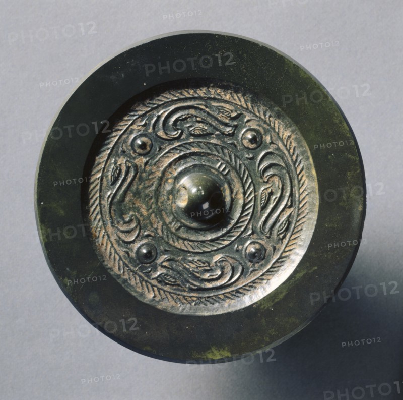 Mirror with Four Nipples, Quasi-Dragons, and Birds, late 3rd Century BC - early 1st Century. China, Western Han dynasty (202 BC-AD 9). Bronze; diameter: 8.8 cm (3 7/16 in.); overall: 0.9 cm (3/8 in.); rim: 0.3 cm (1/8 in.).