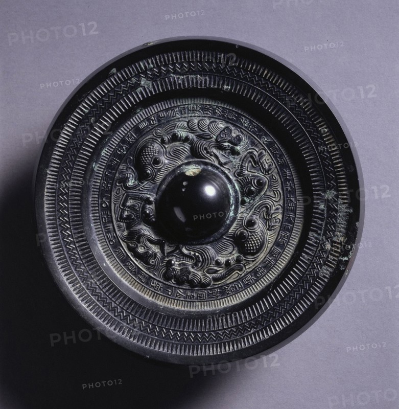 Mirror with Two Dragons and a Tiger, 3rd Century. China, Three Kingdoms (221-280). Bronze; diameter: 14.7 cm (5 13/16 in.); overall: 1.5 cm (9/16 in.); rim: 1.1 cm (7/16 in.).