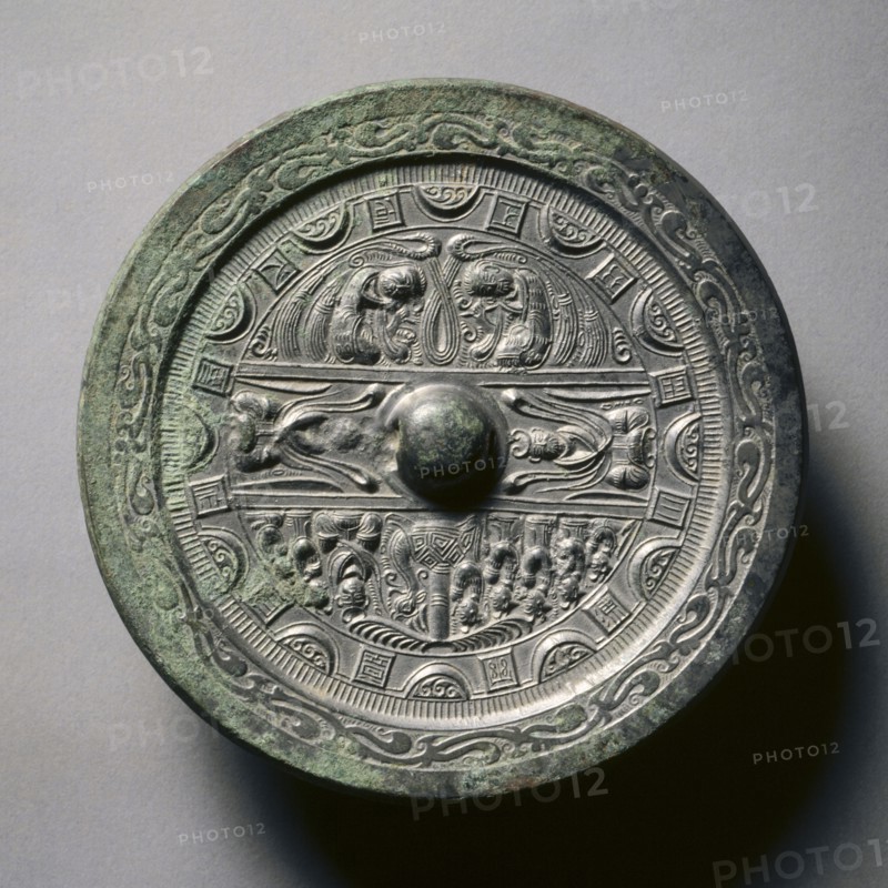 Mirror Featuring Deities and Kings in Three Sections Surrounded by Rings of Squares and Semicircles, late 2nd-early 3rd century. China, Eastern Han dynasty (25-220). Bronze; diameter: 13.9 cm (5 1/2 in.); overall: 1 cm (3/8 in.); rim: 0.4 cm (3/16 in.).