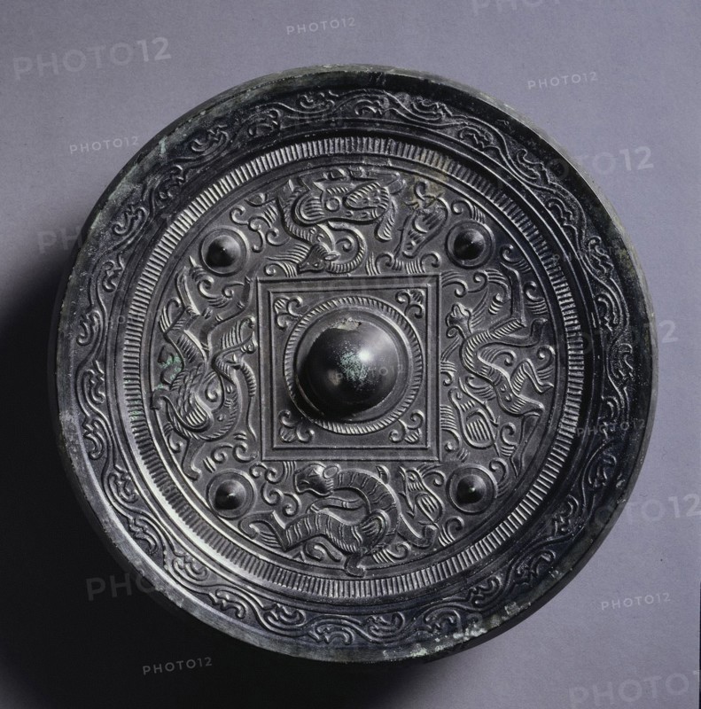 Mirror with a Central Square, an Immortal, and Auspicious Animals, 2nd century. China, Eastern Han dynasty (25-220). Bronze; diameter: 18.5 cm (7 5/16 in.); overall: 1.7 cm (11/16 in.); rim: 0.8 cm (5/16 in.).