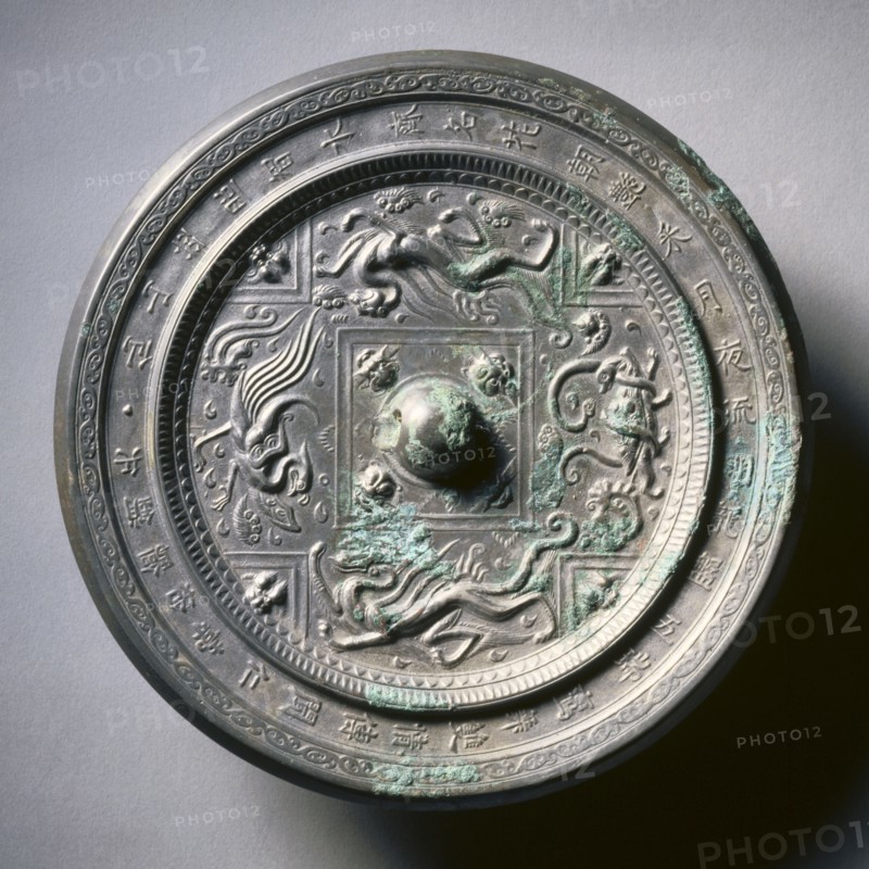 Mirror with Four Spirits, 589-618. China, Sui dynasty (581-618). Bronze; diameter: 19.8 cm (7 13/16 in.); overall: 1.5 cm (9/16 in.); rim: 0.7 cm (1/4 in.).