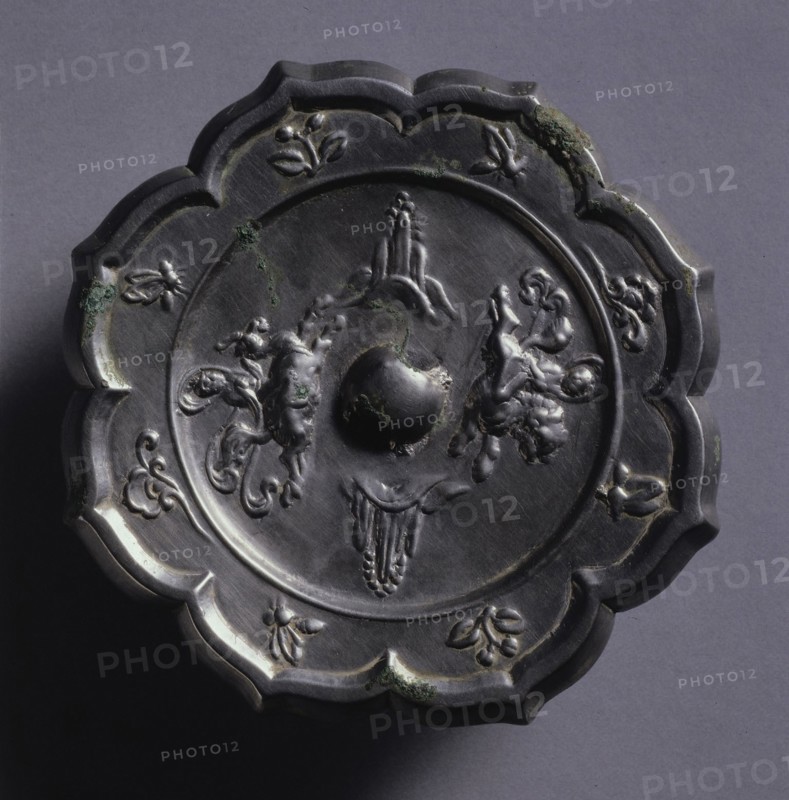 Octafoil Mirror with Riding Immortals and Rising Peaks, 600s. China, Tang dynasty (618-907). Bronze; diameter: 12.2 cm (4 13/16 in.); overall: 0.8 cm (5/16 in.); rim: 0.8 cm (5/16 in.).