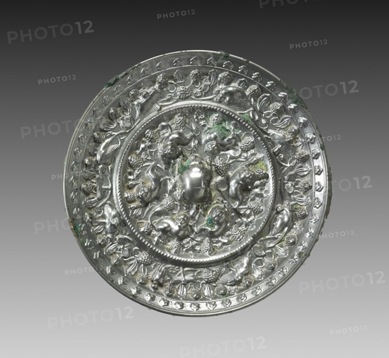 Animal-and-Grape Mirror, late 600s. China, Tang dynasty (618-907). Bronze; diameter: 14.8 cm (5 13/16 in.); overall: 1.5 cm (9/16 in.); rim: 1.5 cm (9/16 in.).