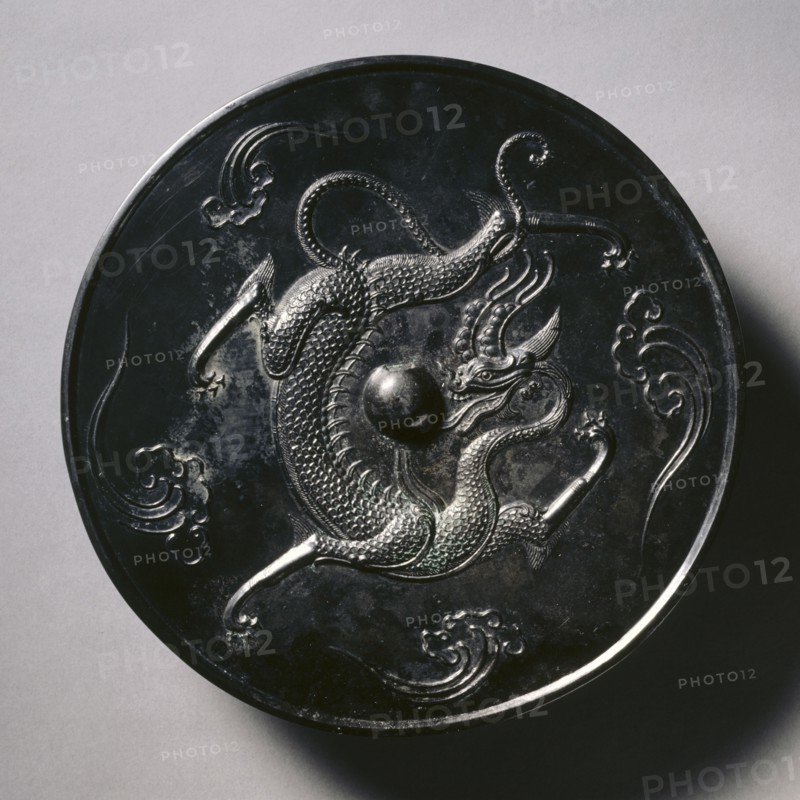Mirror with a Coiling Dragon, 700s. China, Tang dynasty (618-907). Bronze; diameter: 10.2 cm (4 in.); overall: 1.1 cm (7/16 in.); rim: 0.8 cm (5/16 in.).