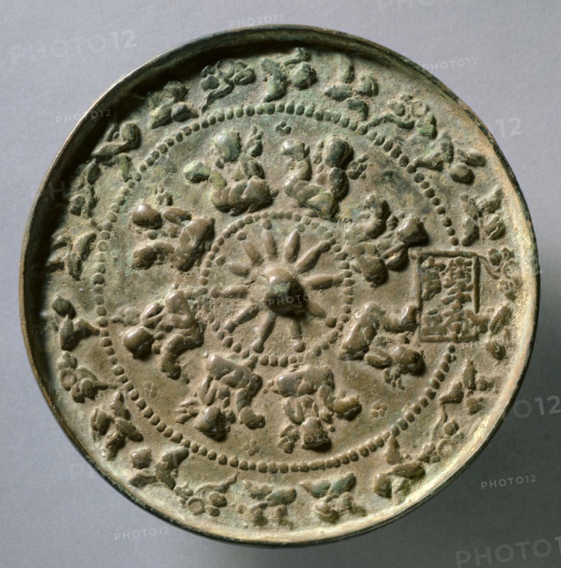 Mirror with Wheel Spokes and Riding Boys, c.1196-1234. China, Jin dynasty (1115-1234). Bronze; diameter: 13.3 cm (5 1/4 in.); overall: 0.8 cm (5/16 in.); rim: 0.7 cm (1/4 in.).