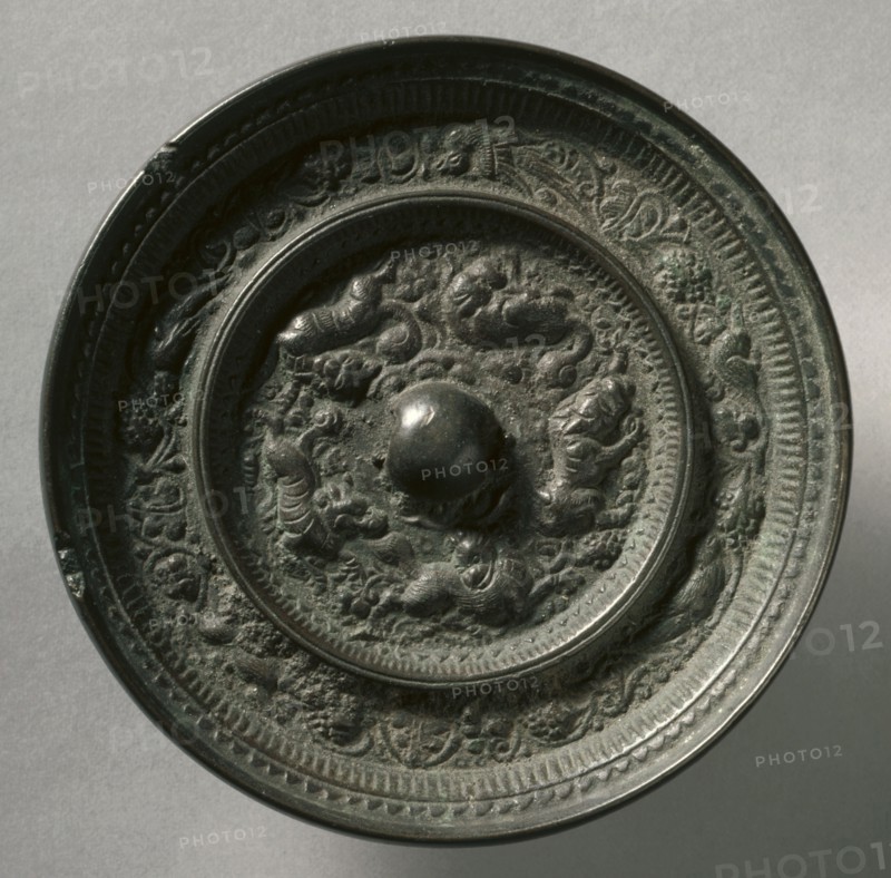 Animal-and-Grape Mirror, early 12th Century-mid 13th Century. China, Jin dynasty (1115-1234). Bronze; diameter: 12.1 cm (4 3/4 in.); overall: 1.2 cm (1/2 in.); rim: 1.2 cm (1/2 in.).