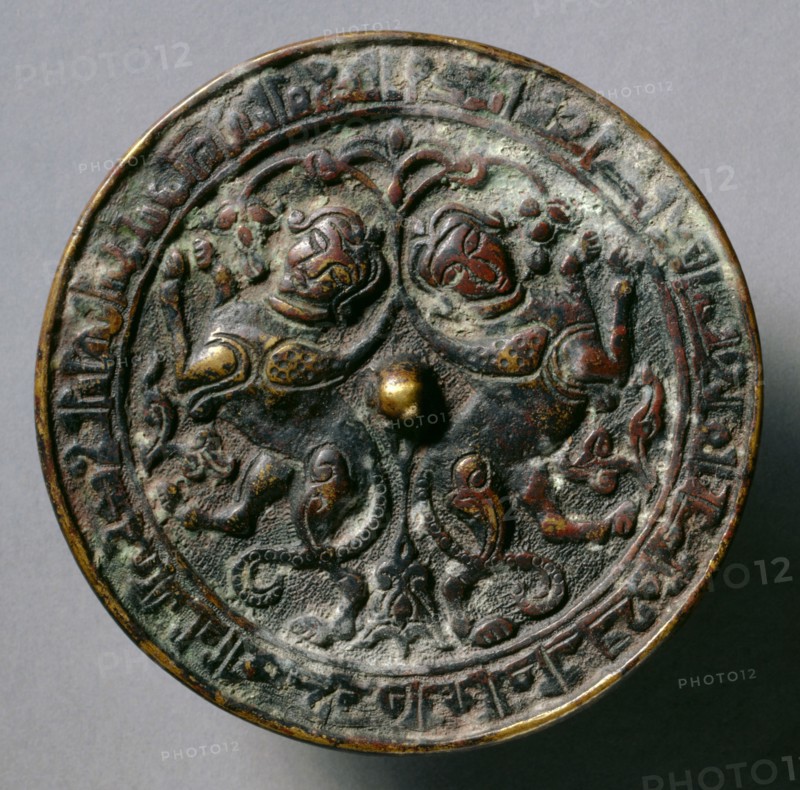 Mirror with Addorsed Sphinxes, 13th Century. Eastern Anatolia or Northern Mesopotamia, 12th-early 13th century. Cast bronze with relief decoration; diameter: 10.6 cm (4 3/16 in.); overall: 0.9 x 0.3 cm (3/8 x 1/8 in.); rim: 0.4 cm (3/16 in.).