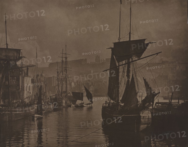 Whitby Harbor, c. 1885. Frank Meadow Sutcliffe (British, 1853-1941). Carbon print, toned, from glass negative; image: 34.3 x 44 cm (13 1/2 x 17 5/16 in.); paper: 34.8 x 44.5 cm (13 11/16 x 17 1/2 in.); matted: 55.9 x 66 cm (22 x 26 in.)