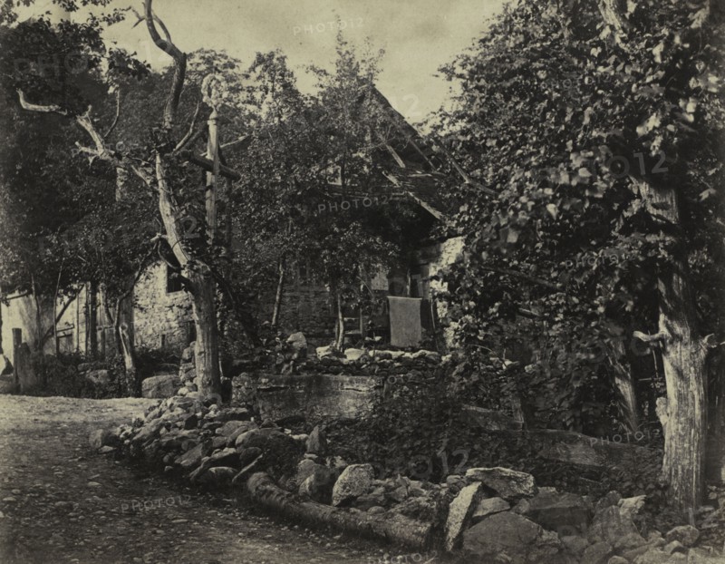 Rural Scene with Stone Building and Cross, c. 1857. Charles-Fortunat-Paul-Casimir Perier (French, 1812-1897). Albumen print from wax paper negative; image: 19.7 x 25.3 cm (7 3/4 x 9 15/16 in.); matted: 40.6 x 50.8 cm (16 x 20 in.)