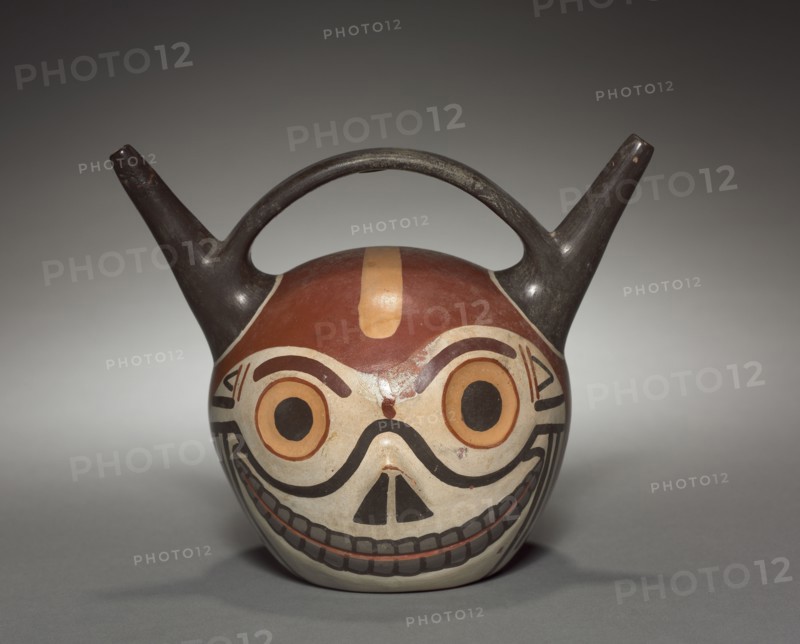 Skull Vessel, 500-900. Wari (Pachacamac) style, Middle Horizon, Epoch 2. Earthenware with colored slips; overall: 14.5 x 17.8 x 12.6 cm (5 11/16 x 7 x 4 15/16 in.).