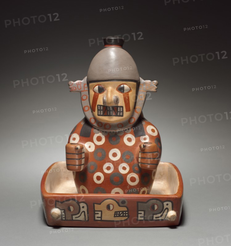 Figure in a Litter, 500-900. Wari (Pachacamac) style, Middle Horizon, Epoch 2. Earthenware with colored slips; overall: 26.3 x 21.6 x 24.8 cm (10 3/8 x 8 1/2 x 9 3/4 in.).