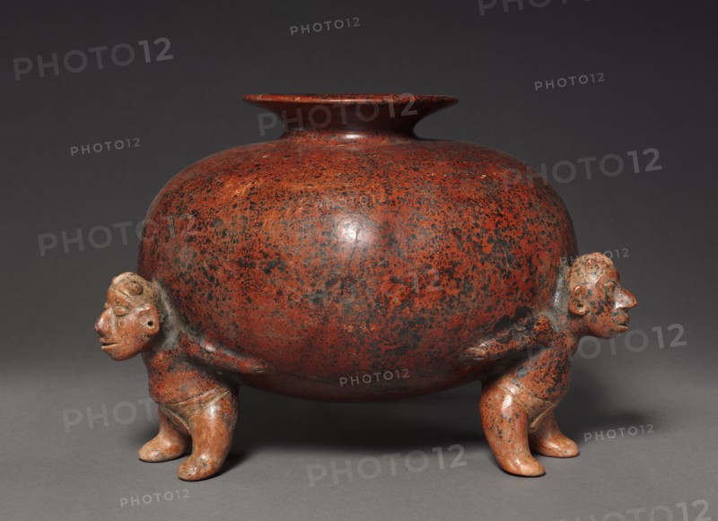 Vessel with Crested Atlantean (Supporting) FIgures, 200 BC-300. West Mexico, Colima, Comala style (200 BC-AD 300). Earthenware with colored slip, black burial deposits; diameter: 24.5 x 33.5 cm (9 5/8 x 13 3/16 in.); overall: 22.9 cm (9 in.).
