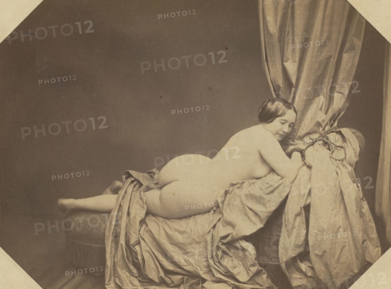 Academic Nude, Reclining on a Sofa, c. 1855. Auguste Belloc (French, 1801-c. 1868). Salted paper print from wet collodion negative; image: 15.8 x 21.2 cm (6 1/4 x 8 3/8 in.); matted: 40.6 x 50.8 cm (16 x 20 in.)
