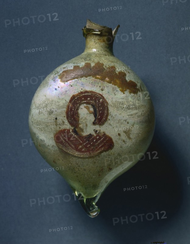 Pilgrim's Flask with Nimbed Figure, c. 400-600. Byzantium, Syria-Palestine, Byzantine period, 5th-7th Century. Opaque glass with paint; overall: 10.5 x 6.9 cm (4 1/8 x 2 11/16 in.)