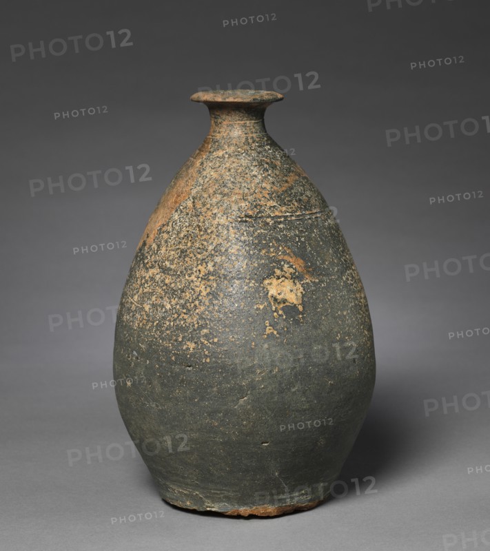 Bottle with a Flattened Side, 700s-800s. Korea, late Unified Silla (676-935) or early Goryeo (918-1392) period. Stoneware with incised designs; overall: 25.1 cm (9 7/8 in.); diameter: 15.9 cm (6 1/4 in.).