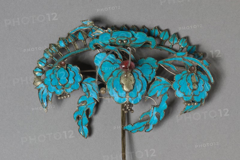 Headdress Ornament, 1800s-1900s. China, Qing dynasty (1644-1911). Gilt copper-silver alloy decorated with kingfisher feathers and glass beads; overall: 8.9 x 8.6 cm (3 1/2 x 3 3/8 in.).