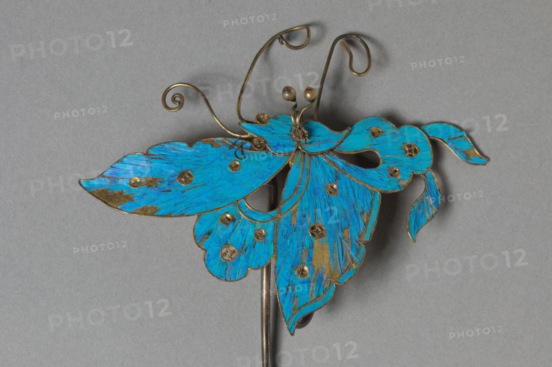 Headdress Ornament, 1800s-1900s. China, Qing dynasty (1644-1911). Gilt copper-silver alloy decorated with kingfisher feathers and glass beads; overall: 8.1 x 8.5 cm (3 3/16 x 3 3/8 in.).
