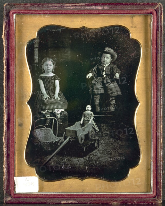 Two Children with Toys, c. 1855. Unidentified Photographer. Daguerreotype, quarter-plate; image: 10.8 x 8.3 cm (4 1/4 x 3 1/4 in.); case: 12.1 x 9.4 cm (4 3/4 x 3 11/16 in.); matted: 61 x 50.8 cm (24 x 20 in.)
