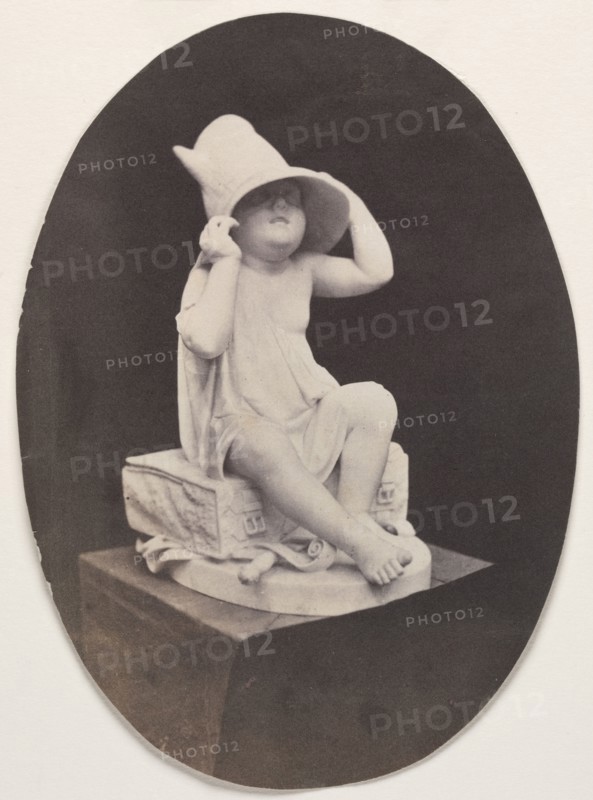 Statue of a Youth in Large Hat (from a John R. Johnston album), before 1857. Unidentified Photographer. Salted paper print from wet collodion negative; overall: 17.8 x 12.9 cm (7 x 5 1/16 in.); matted: 50.8 x 40.6 cm (20 x 16 in.).