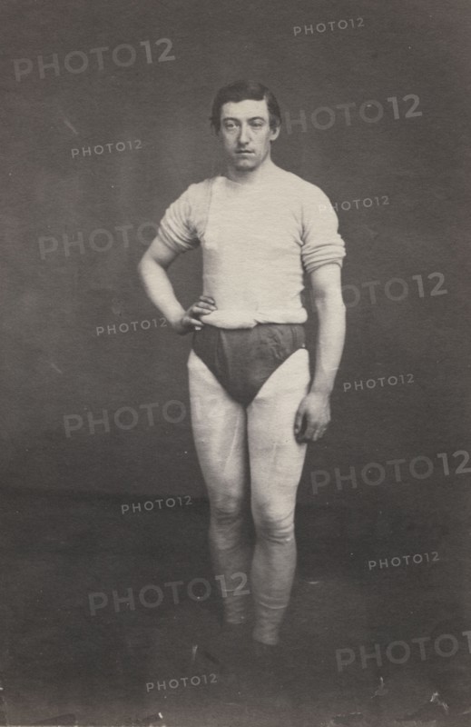 Young Man in Athletic Outfit, c.1857. Attributed to Oliver H. Willard (American, 1828-1875). Salted paper print from wet collodion negative; image: 21.5 x 16.5 cm (8 7/16 x 6 1/2 in.); paper: 22.4 x 17 cm (8 13/16 x 6 11/16 in.); matted: 50.8 x 40.6 cm (20 x 16 in.)