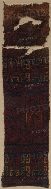 Textile Fragment with Frontal Deity Heads, Felines, and Interlace Pattern, 700 BC- 400 BC. Peru, South Coast, Paracas (700 BC - 1 AD), Yauca Valley?. Camelid fiber; double-cloth with structural embroidery; overall: 83.2 x 21.6 cm (32 3/4 x 8 1/2 in.).