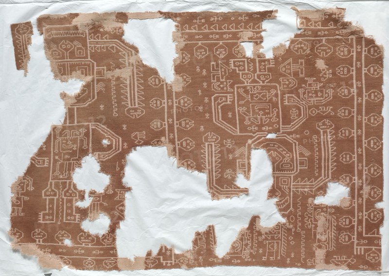 Fragment of a Mantle with Oculate Being, 200 BC-1. Peru, South Coast, Paracas (700 BC - 1 AD), Carhua?. Cotton; double-cloth; overall: 74.9 x 108 cm (29 1/2 x 42 1/2 in.).