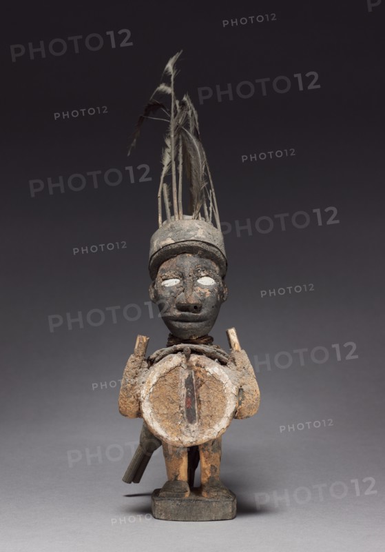 Figurine, late 1800s-early 1900s. Central Africa, Republic of the Congo, Kongo people. Wood and various other materials; overall: 34 x 9.5 x 25 cm (13 3/8 x 3 3/4 x 9 13/16 in.)