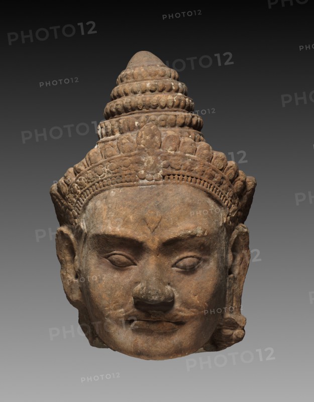 Colossal Head of a Deva, c. 1200. Cambodia, Angkor, c. early 13th century. Sandstone; overall: 71.3 x 50 x 47 cm (28 1/16 x 19 11/16 x 18 1/2 in.).