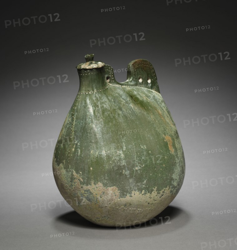 Leather Bag-Shaped Flask with Cover, 916-1125. Northeast China, Liao dynasty (916-1125). Earthenware with green glaze; overall: 24.5 x 16.5 x 16 cm (9 5/8 x 6 1/2 x 6 5/16 in.).