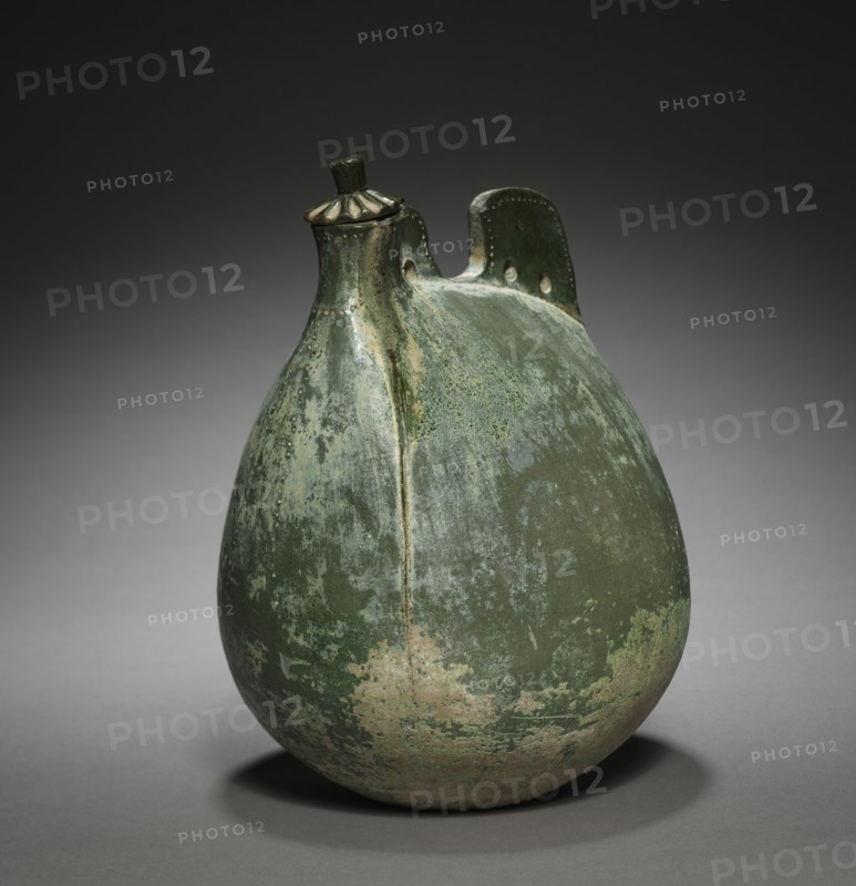 Leather Bag-Shaped Flask with Cover, 916-1125. Northeast China, Liao dynasty (916-1125). Earthenware with green glaze; overall: 23.5 x 17.5 x 13.8 cm (9 1/4 x 6 7/8 x 5 7/16 in.).