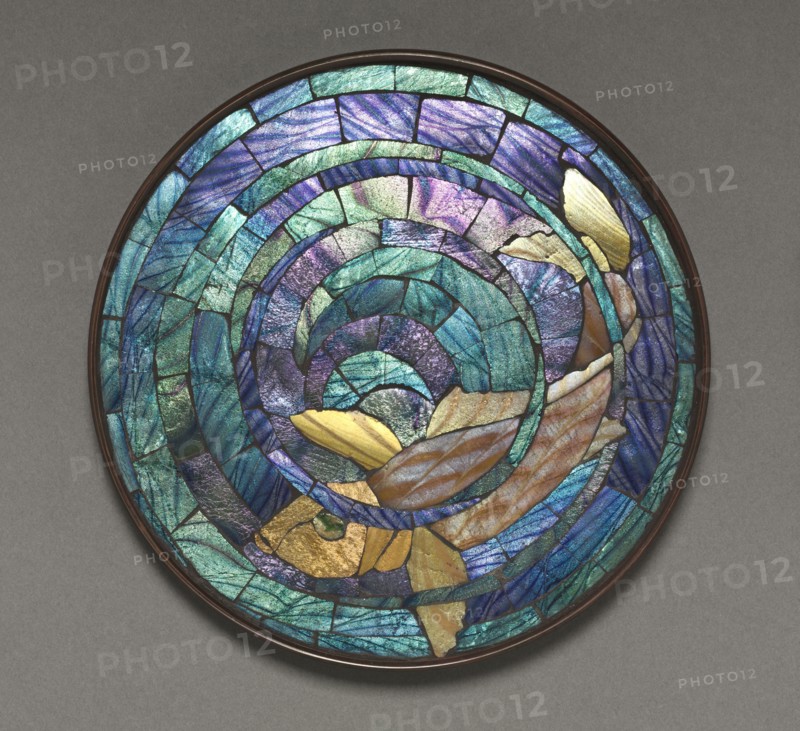 Round Mosaic Trivet (fish), c. 1895-1902. Tiffany Glass and Decorating Company. Glass, bronze; overall: 1.3 x 17.8 cm (1/2 x 7 in.).